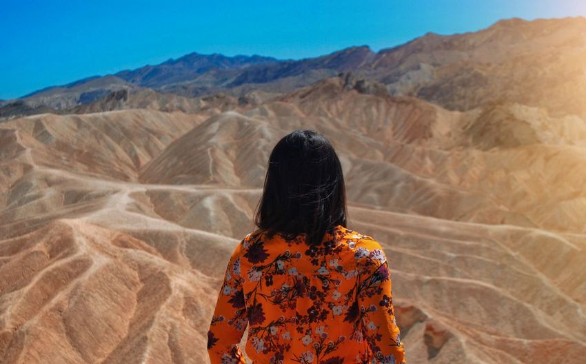 Rear view of woman looking at desert