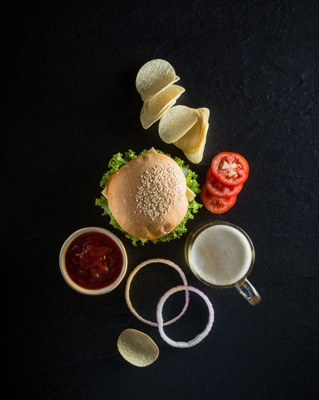 High angle view of fast food over black background