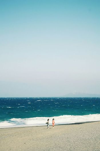 Scenic view of sea against blue sky