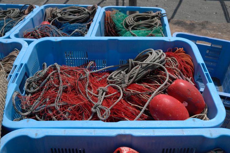 High angle view of fishing net in container