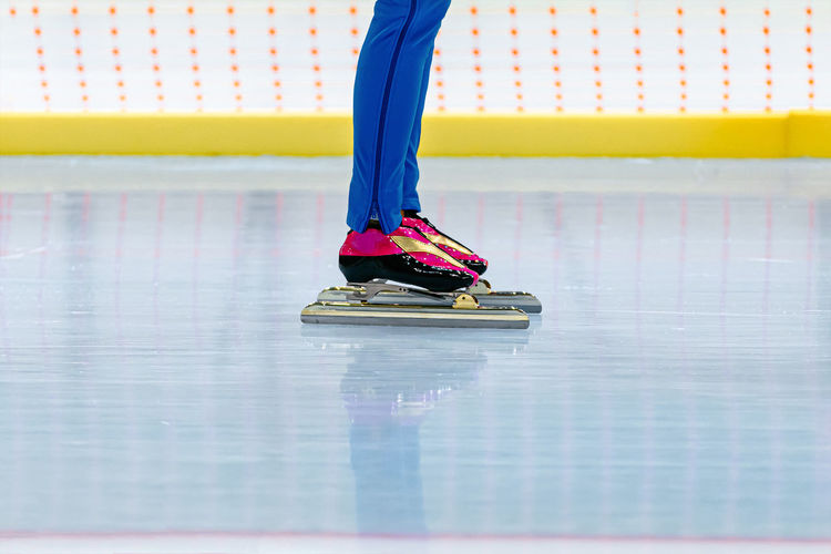 Legs girl skater in ice skating ring