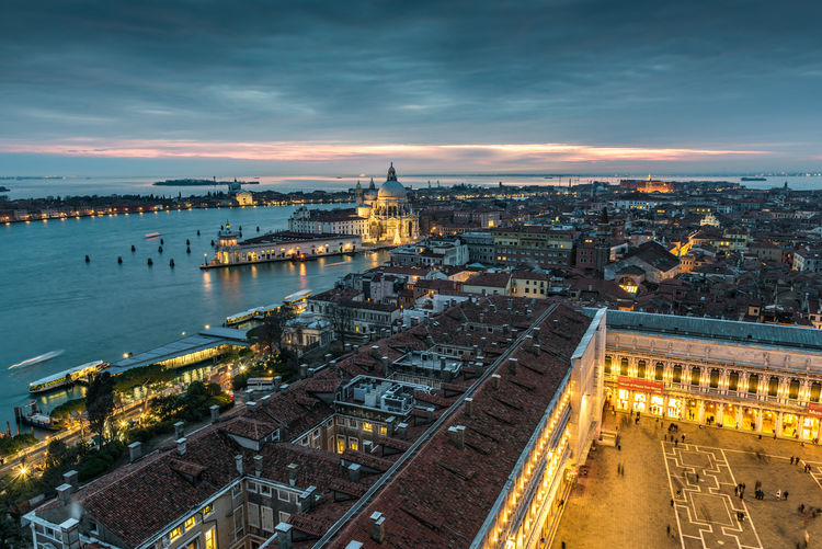 High angle view of illuminated cityscape against sky