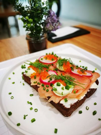 High angle view of open faced sandwich in plate on table
