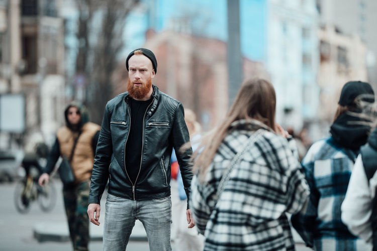 Men walking on street in city