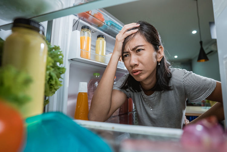 Mid adult woman looking at home