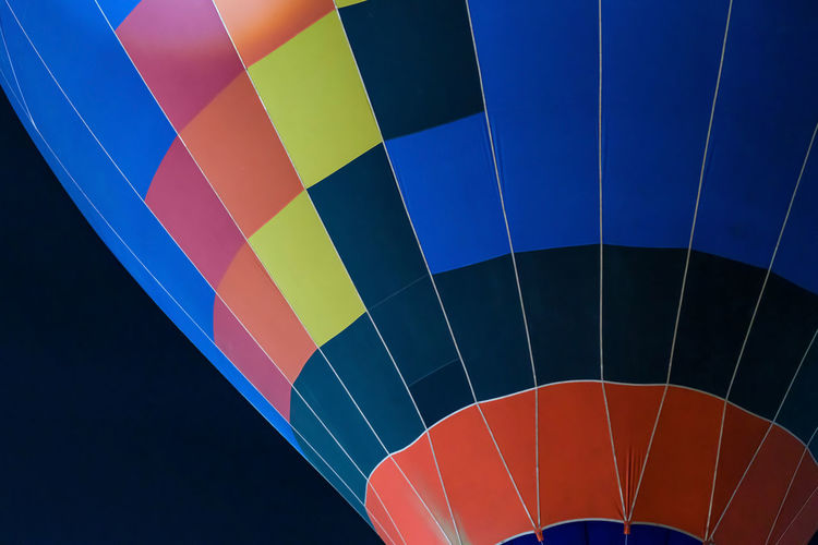 Colorful hot air balloon ready for take off in sky in night. freedom concept.