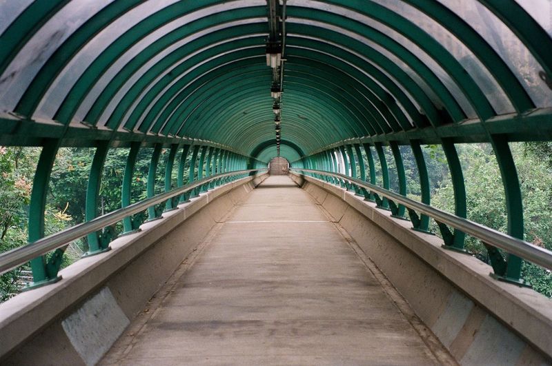 Empty footbridge along footpath