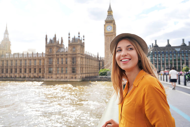 Smiling female tourist visiting london sights, united kingdom