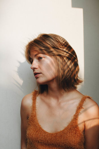 Beautiful Beauty Casual Clothing Female Front View Golden Hour Human Face Indoors Lifestyles Long Hair Person Portrait Portrait Of A Woman Portraits Shadow Shadowplay Shadows & Lights Sunset Young Adult Young Women