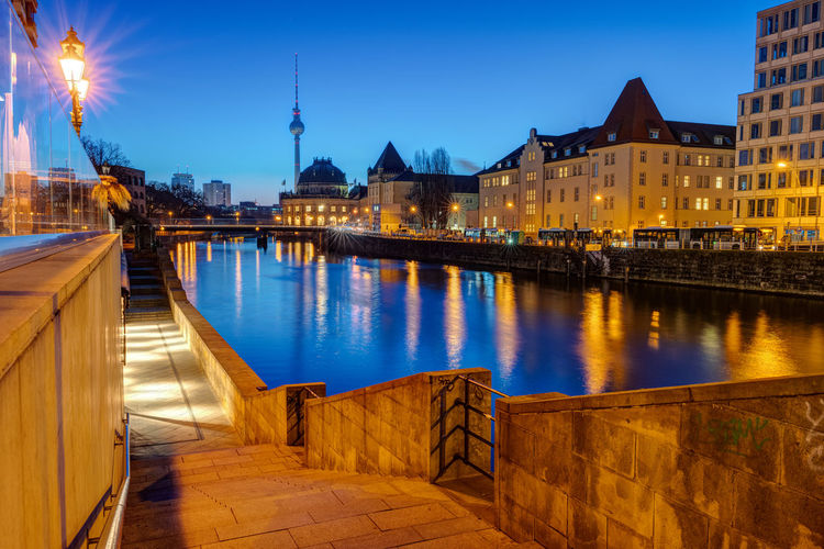 View along the banks of the river spree in berlin at twilight