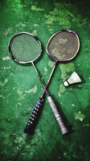 High angle view of badminton rackets with shuttlecock