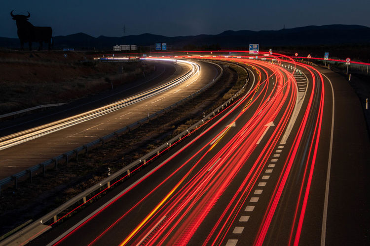High angle view of light trails on highway at night. la mancha. spain