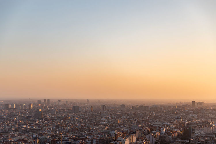 High angle view of city at sunset