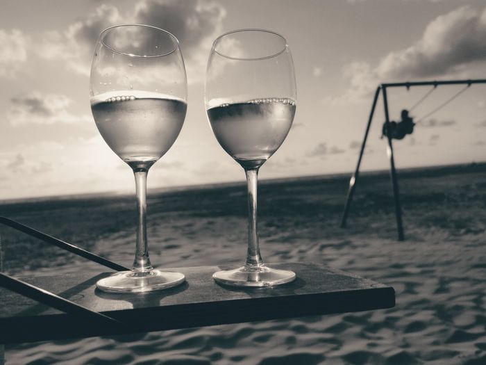 Close-up of wine glasses on table