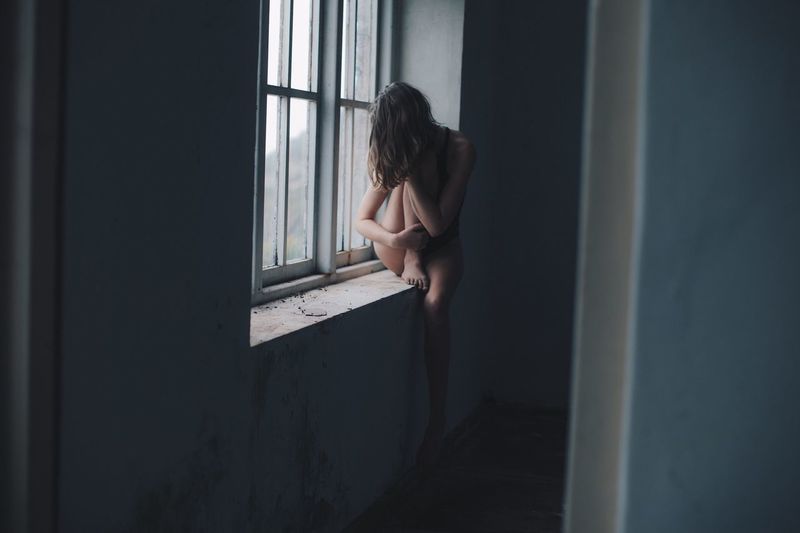 Window Real People Indoors One Person Lifestyles Young Women Young Adult Home Interior Leisure Activity Women Day Domestic Room Shirtless Long Goodbye