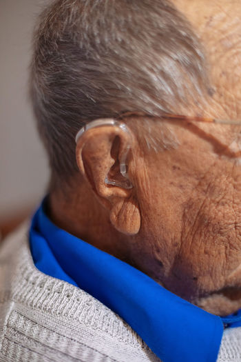 Close-up of senior man wearing hearing aid