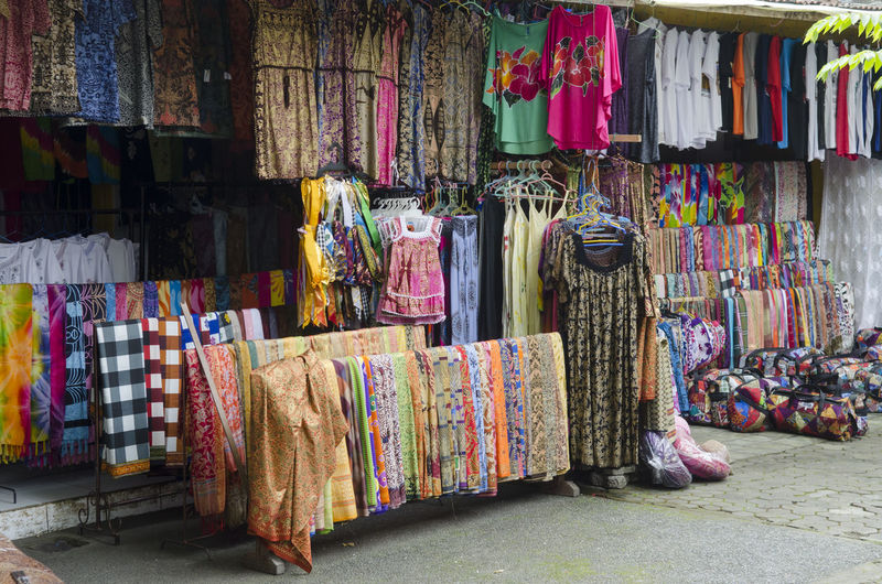Clothes hanging in store for sale at market stall