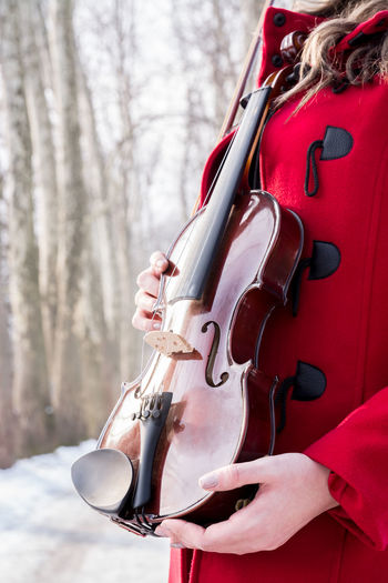 Close-up of woman holding a violin