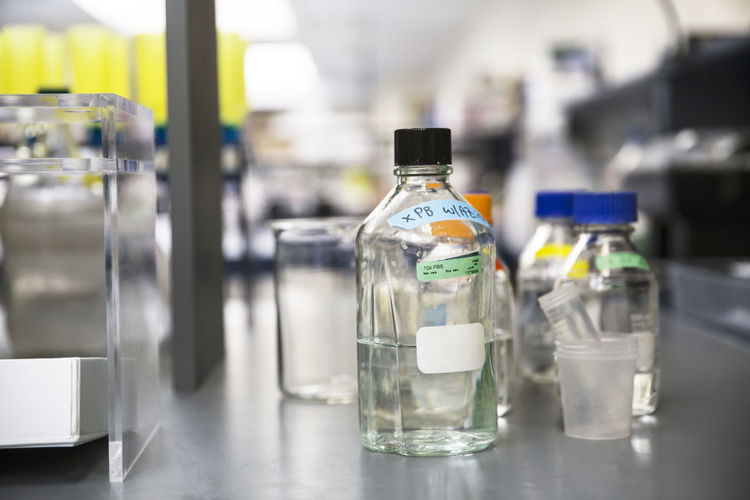 Close-up of sample bottles on counter in laboratory