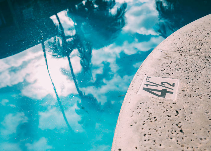 High angle view of text on swimming pool against sky