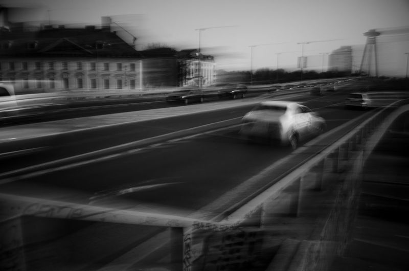 Blurred motion of cars on road in city