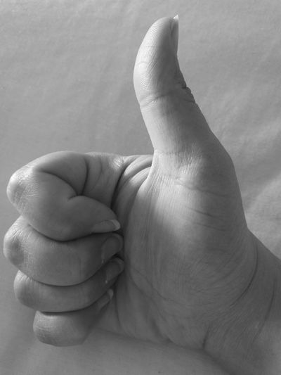 Cropped image of hand with thumbs up