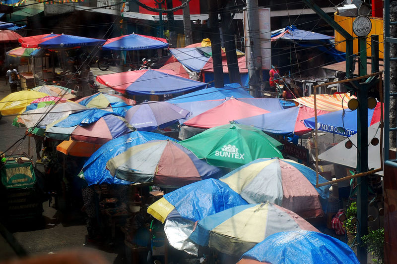 High angle view of parasols at street market
