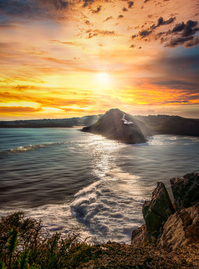 Scenic view of sea against sky during sunset