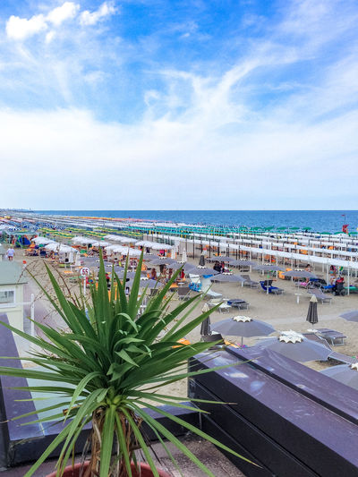 Beach umbrellas against sky