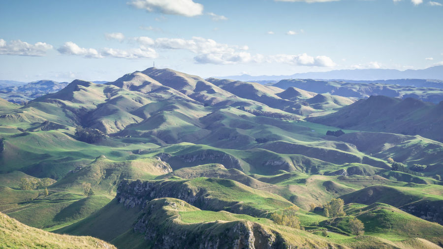 Rolling green hills and blue sky panorama te mata peak,hawkes bay region,north island, new zealand