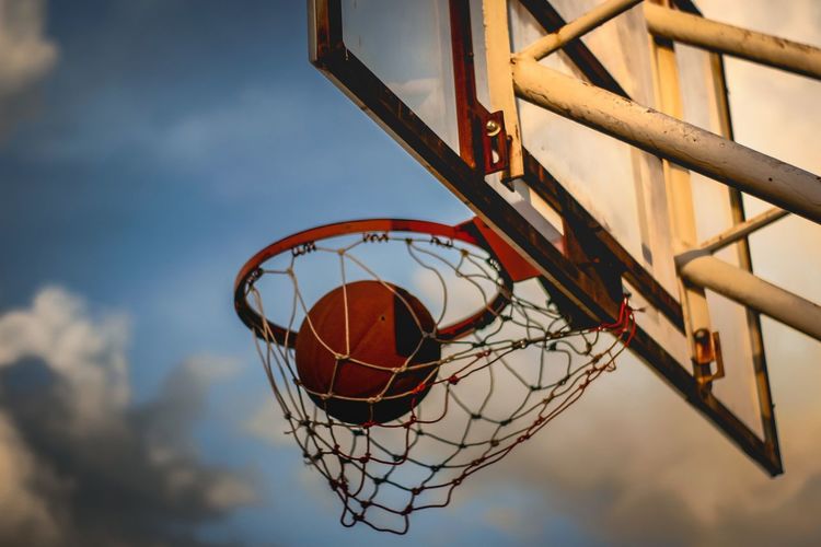 Low angle view of basketball hoop against sky