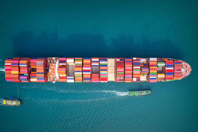 Container ship in export and import business and logistics. aerial view