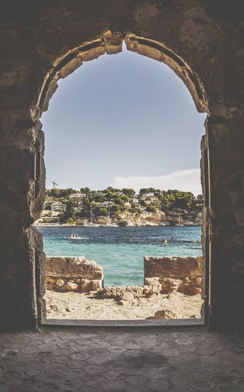 Sea seen through arch window