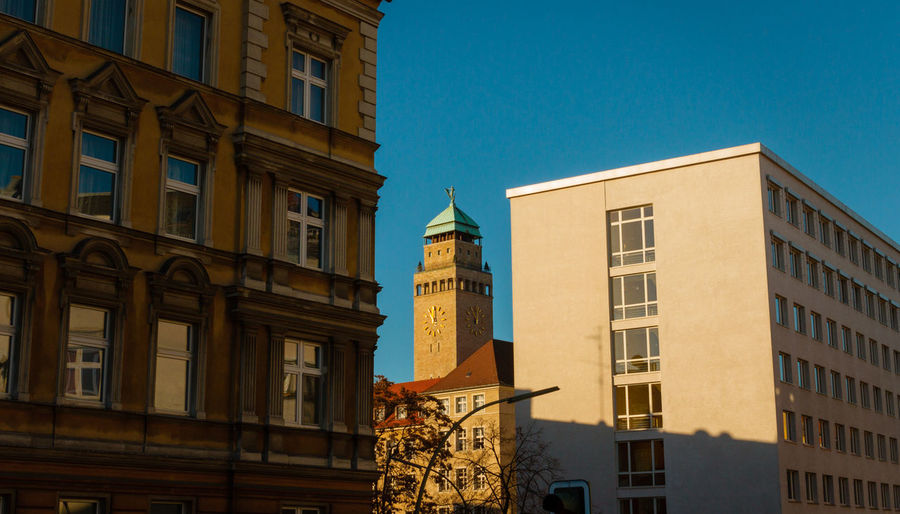 Low angle view of clock tower against sky