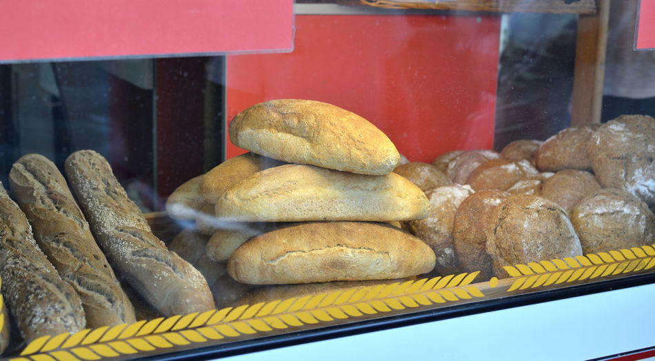 Shop window of a bakery with fresh loafs of bread