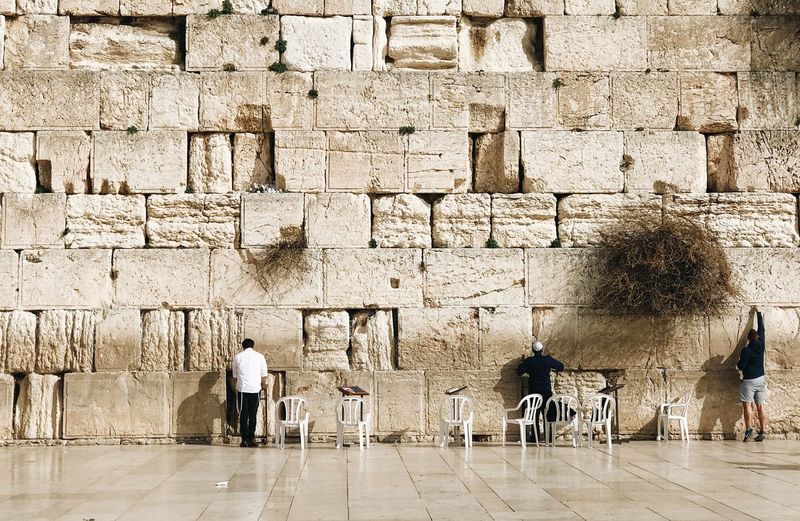 Rear view of men in jerusalem