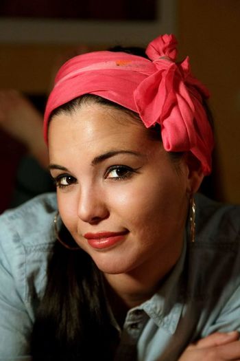 Close-up portrait of beautiful woman wearing headband