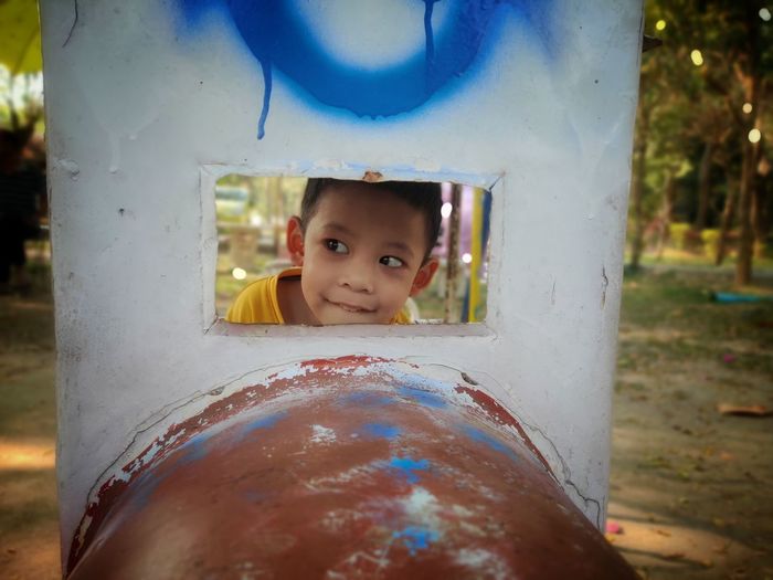 Portrait of cute boy smiling in playground