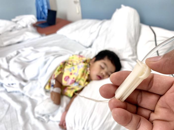Boy lying on bed at home