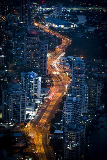 High angle view of illuminated city street at night
