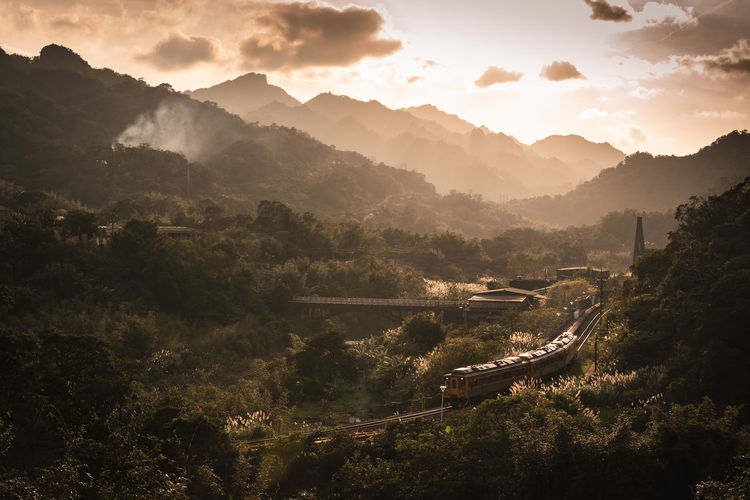 Train in the mountains during sunset
