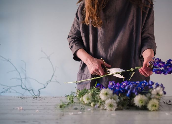 Close-up of woman holding flowers
