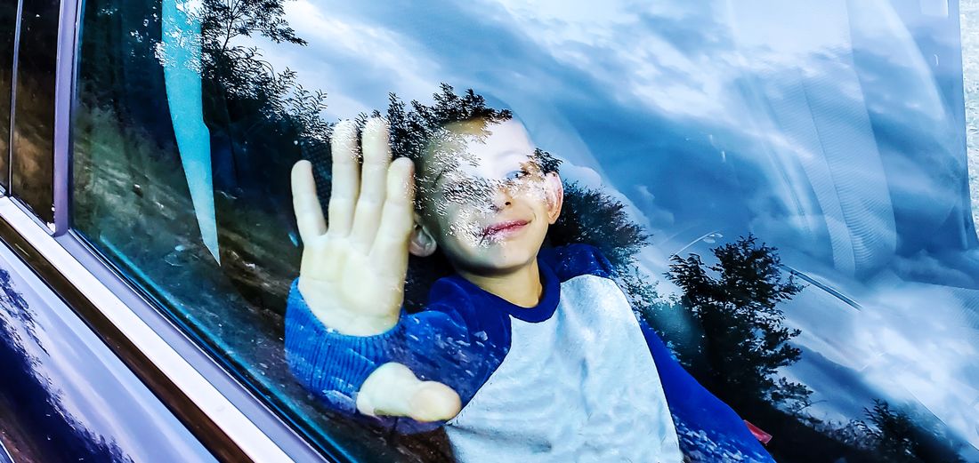 Portrait of smiling girl in glass