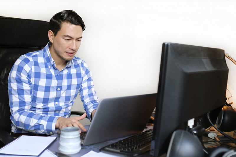 Young woman using laptop at home