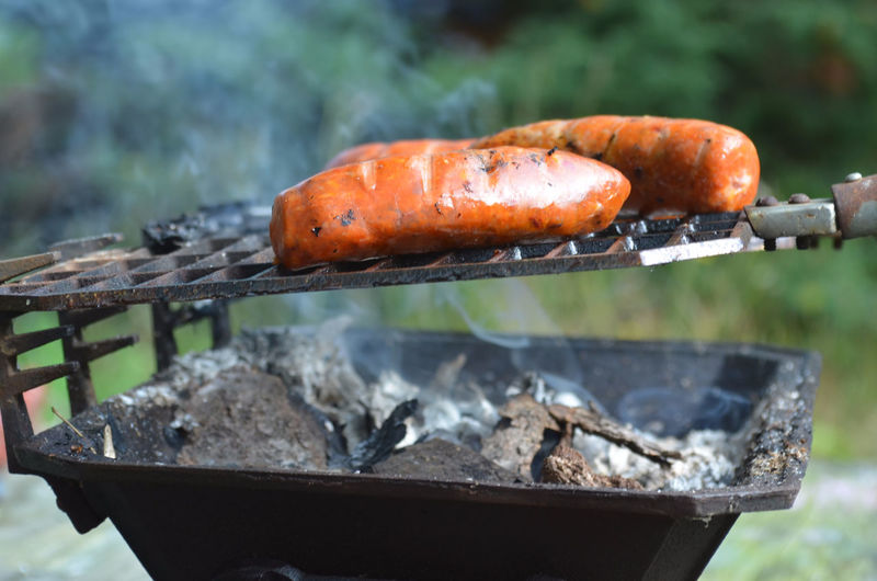 Close-up of sausages being grilled on barbecue