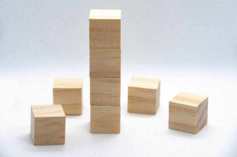 Close-up of wooden blocks on white background