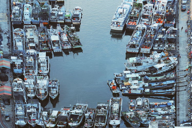 High angle view of boats moored at harbor