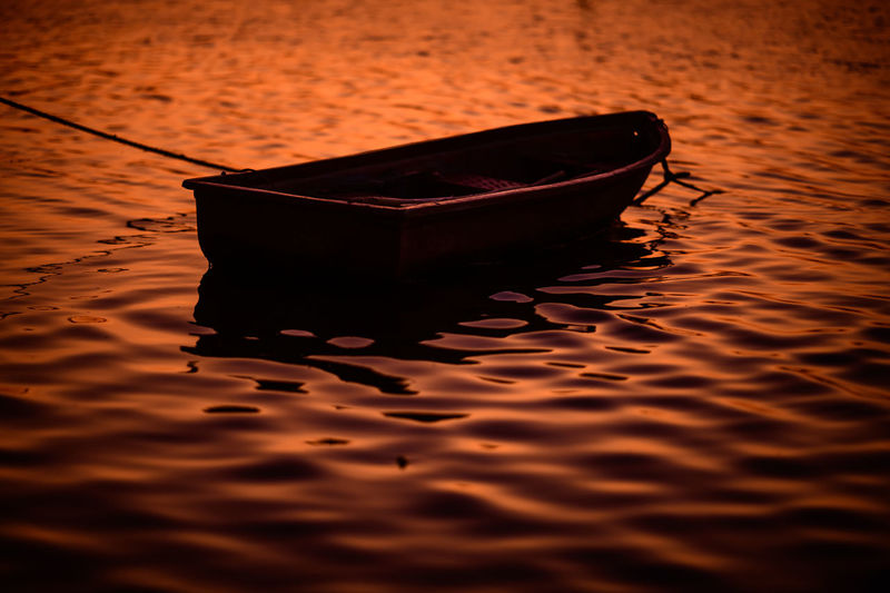 Close-up of boat floating on water