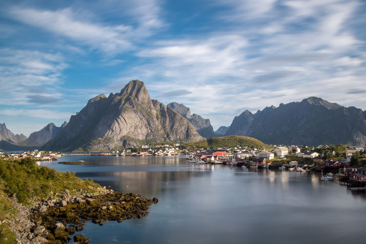 Scenic view of lake and mountains against sky