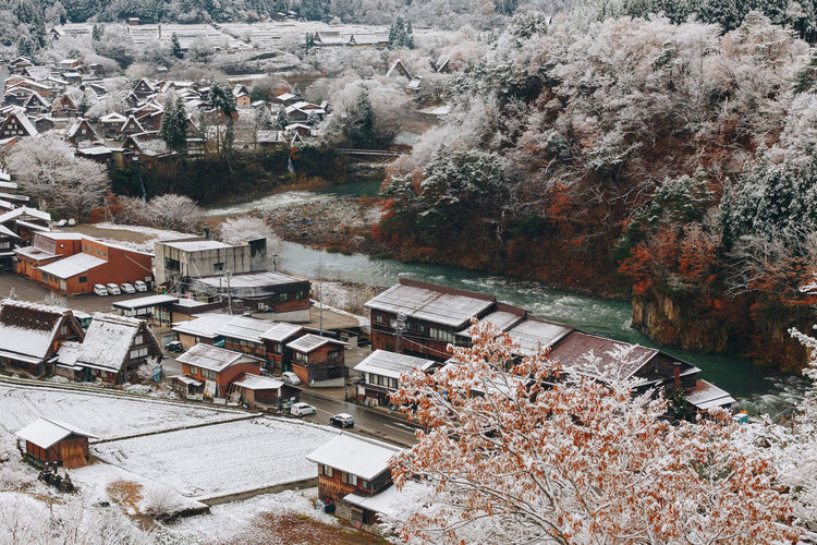 High angle view of buildings and trees during winter